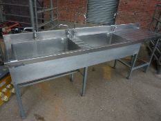 Double bowl sink with single drainer.