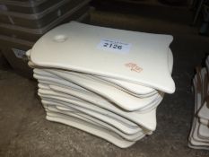 24 ceramic serving trays.