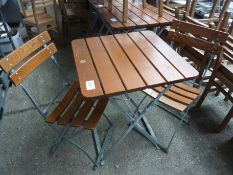 Folding table and two chairs.