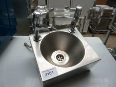 Hand wash sink with taps.