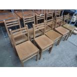 Ten wooden chairs.