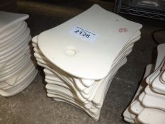 24 ceramic serving trays.