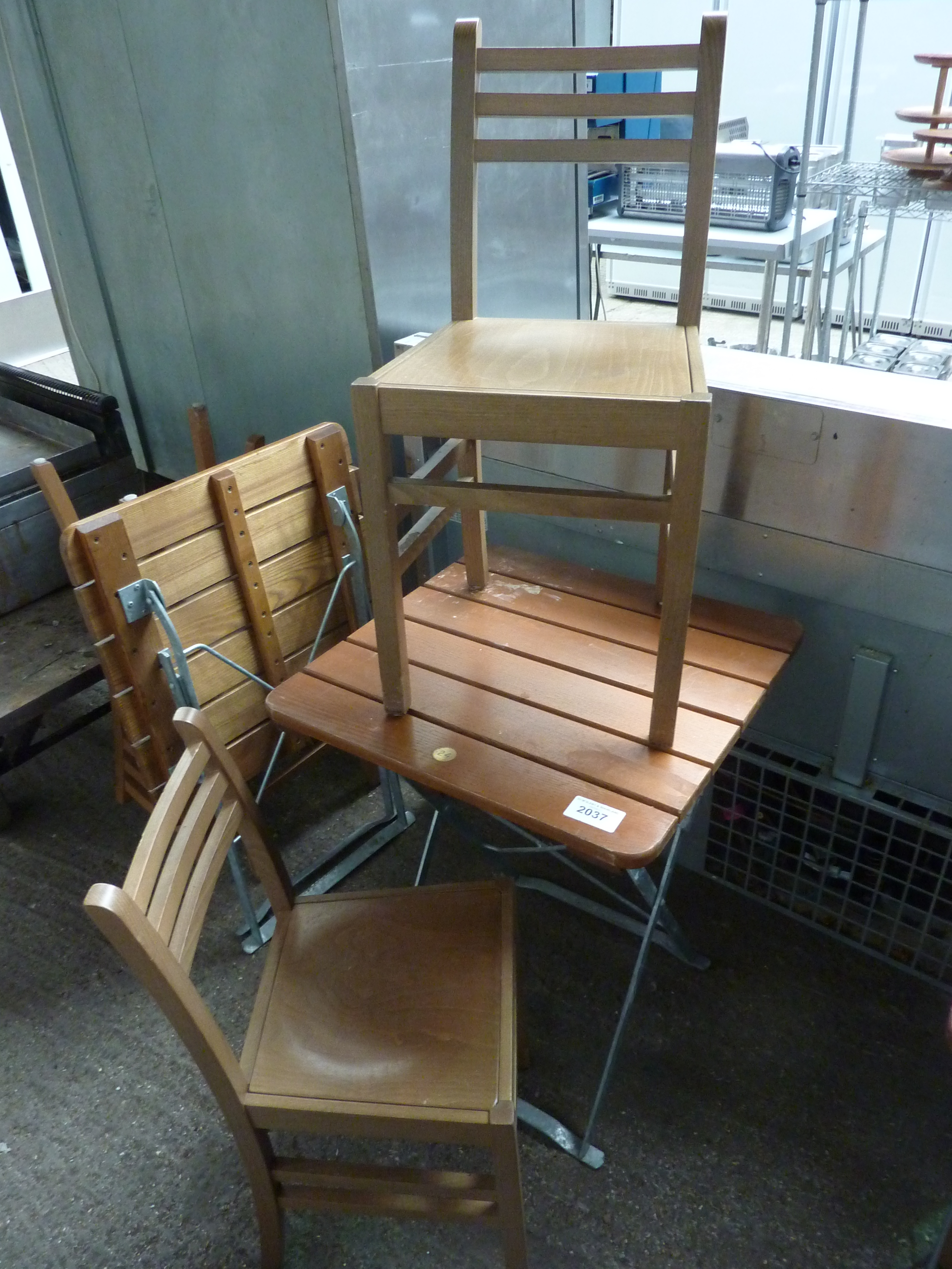 Folding table and two chairs.