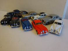 10 assorted Jaguar cars.