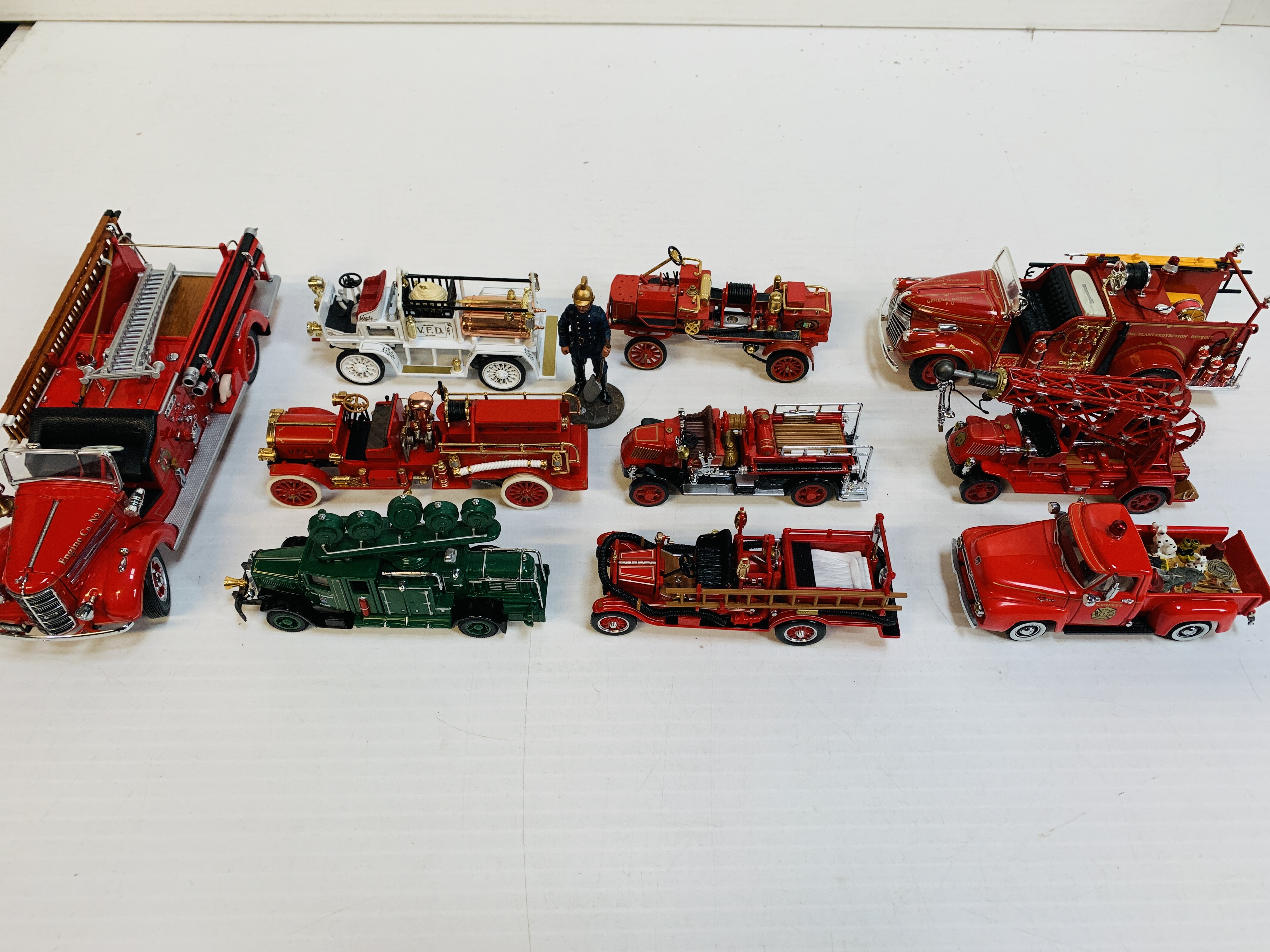 Ten assorted fire fighting vehicles, and a fireman.