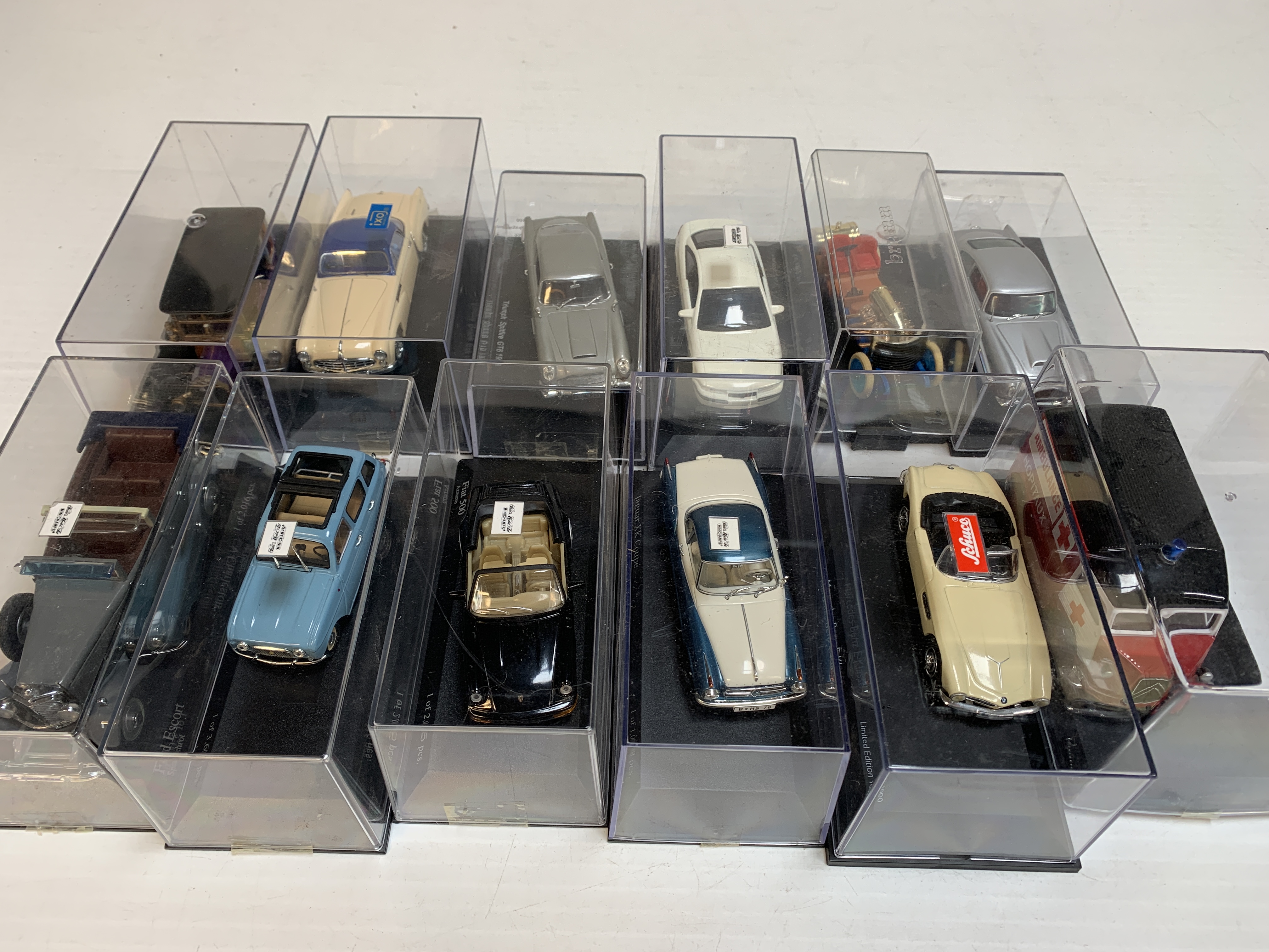 Twelve boxed diecast model cars