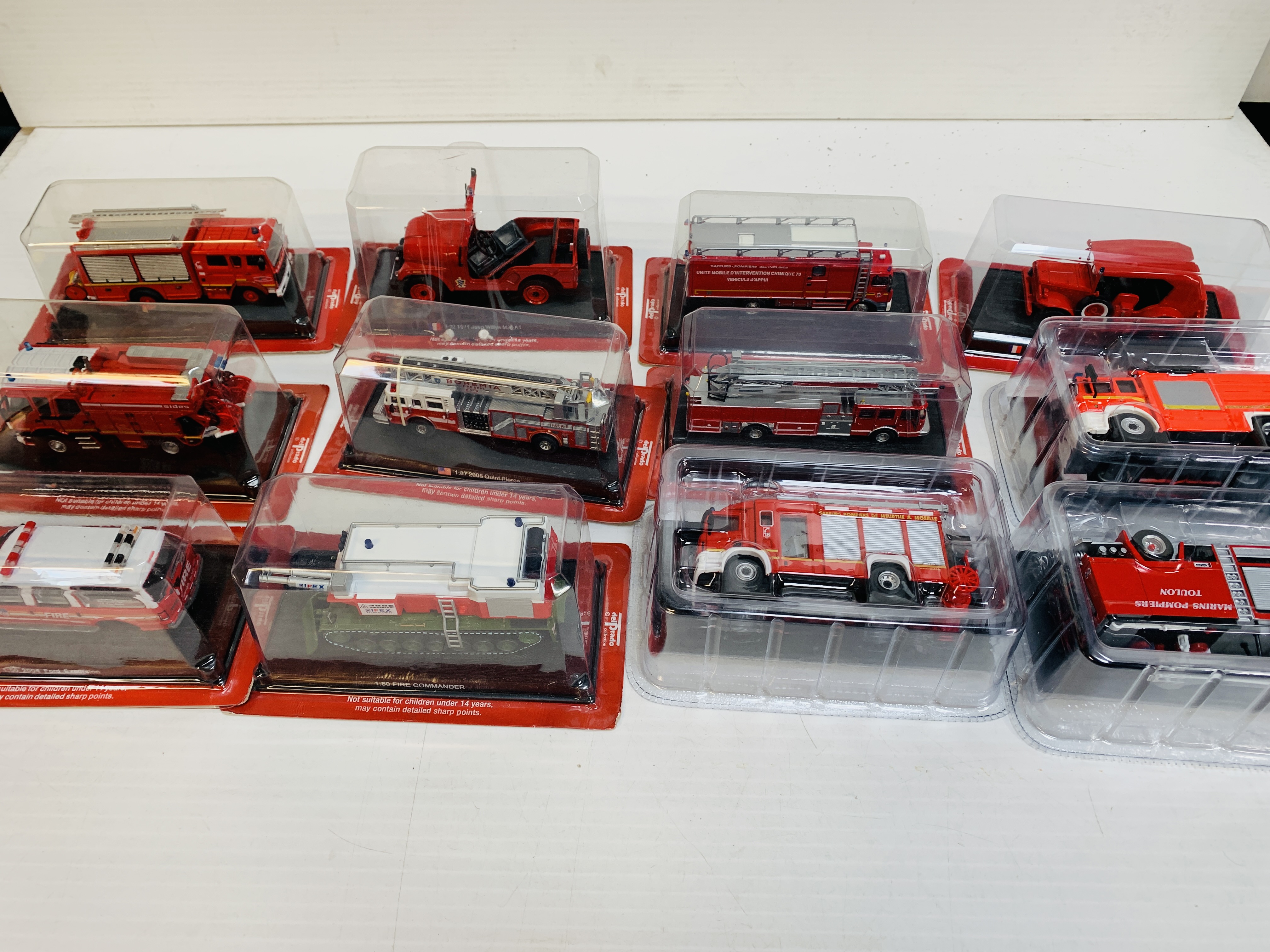 Twelve boxed Del Prado fire fighting vehicles