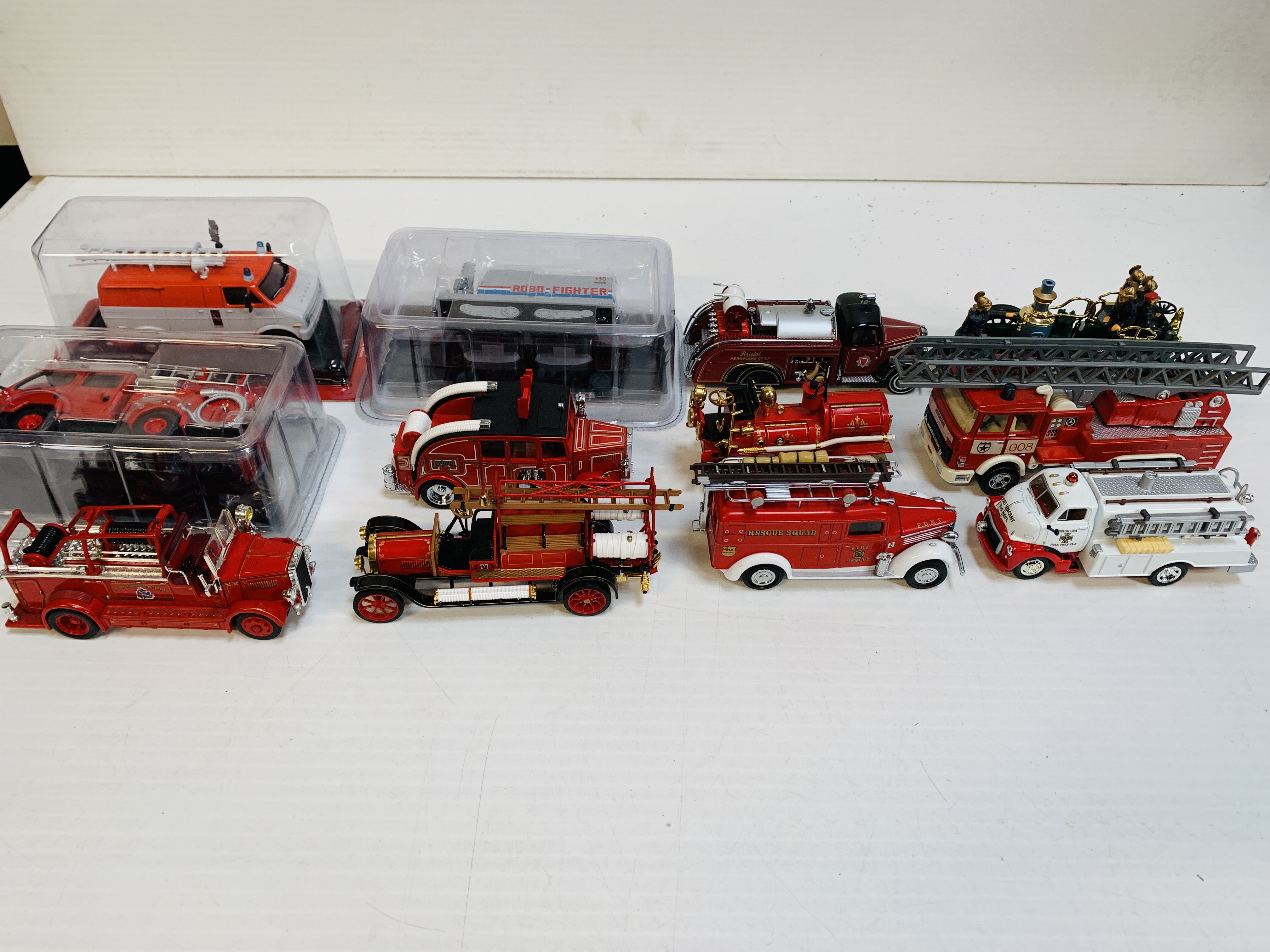 Twelve assorted fire fighting vehicles.