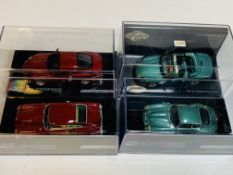 Four various model Aston Martins