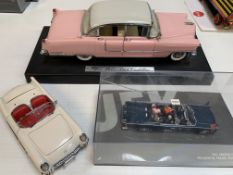 Three large model cars