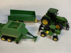 John Deere 6920 Tractor and Trailer; and a John Deere Baler & Sprayer.