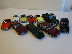 Nine assorted model cars and a green Chevrolet Truck