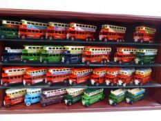 Wooden display case containing 29 assorted Buses