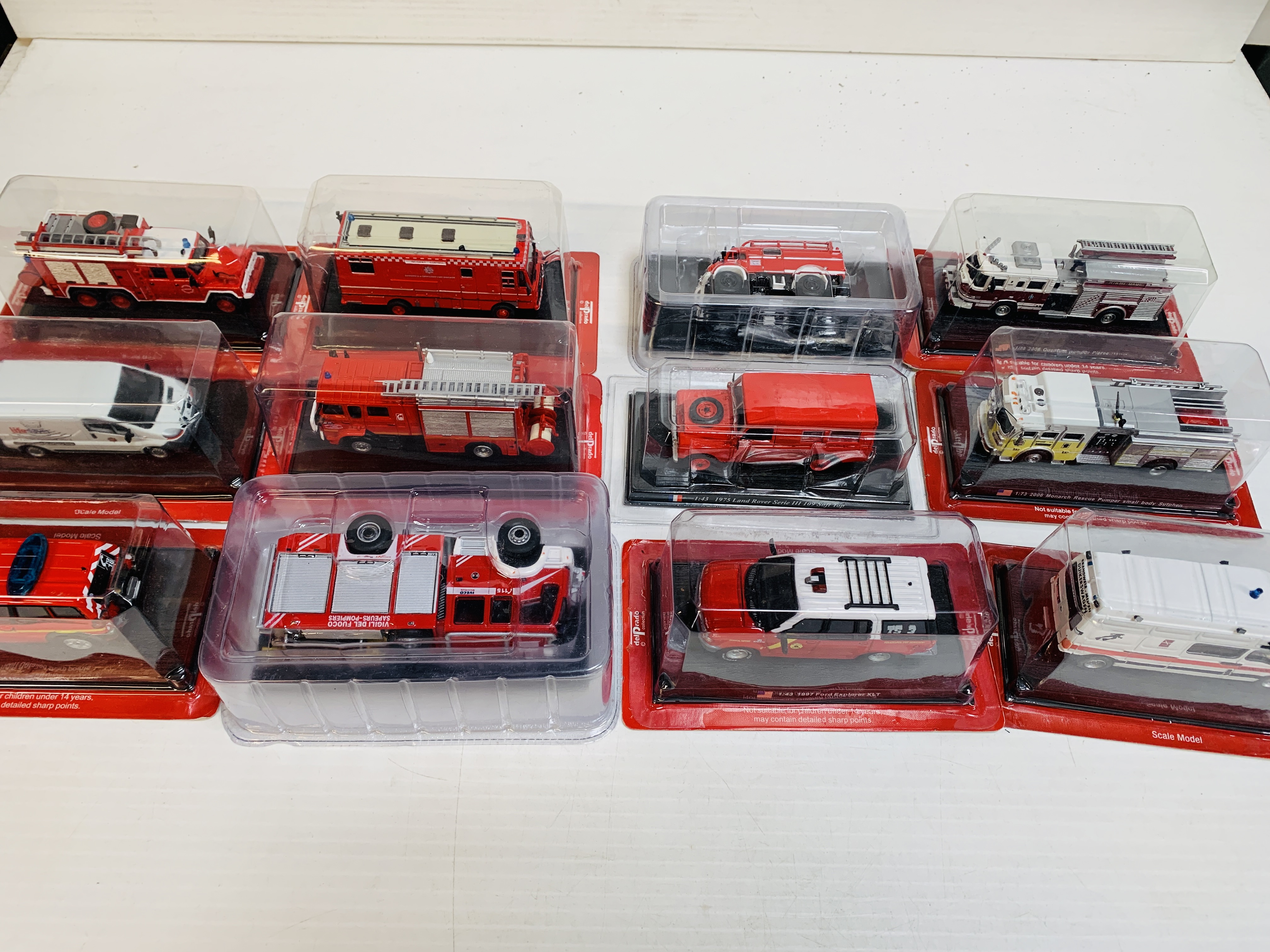 Twelve boxed Del Prado fire fighting vehicles