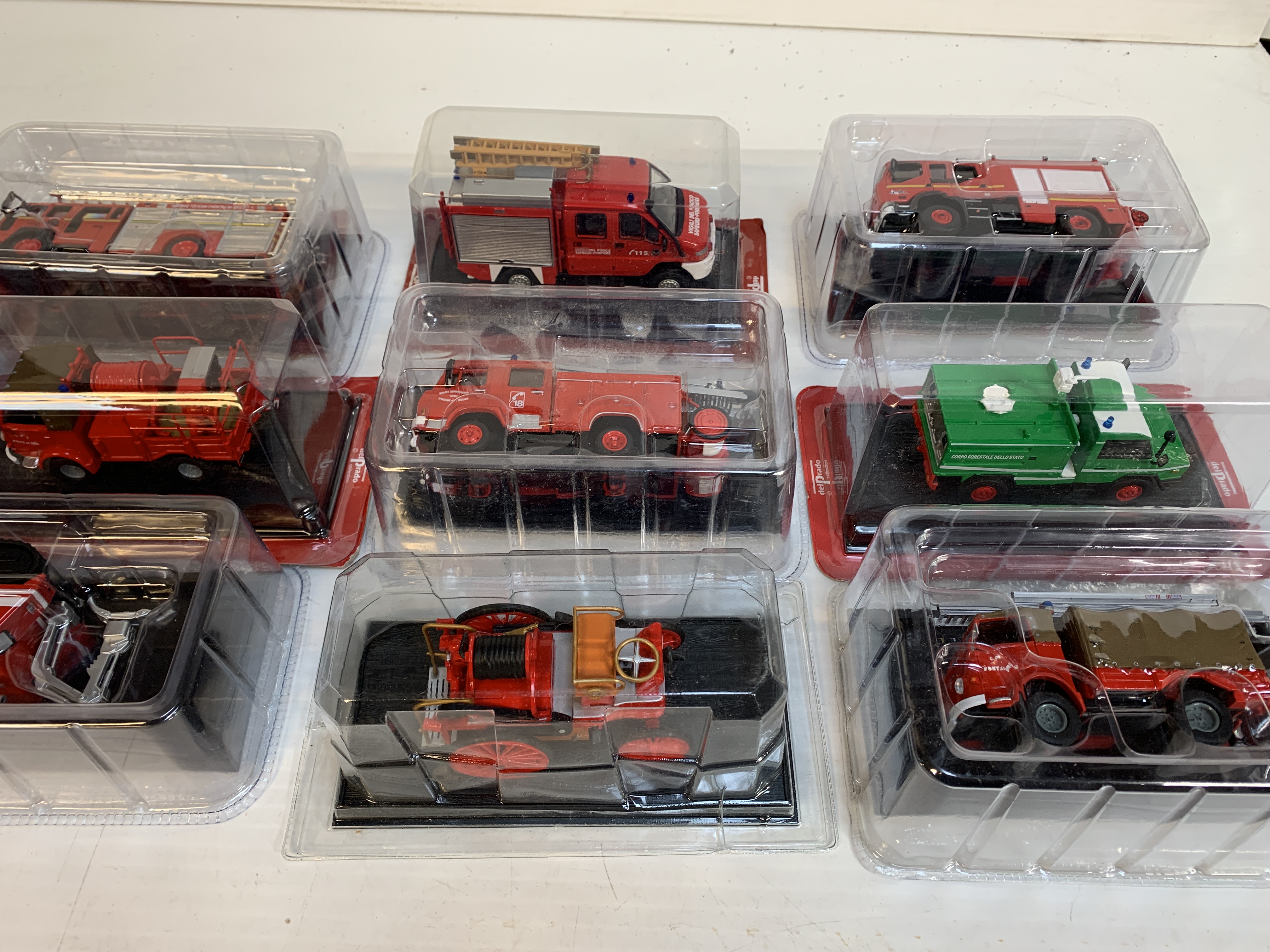 Twelve boxed Del Prado fire fighting vehicles