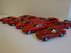 Eleven assorted red Ferraris