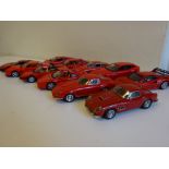 Eleven assorted red Ferraris