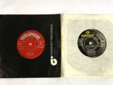 Box of LPs and singles, including two Parlophone Beatles singles