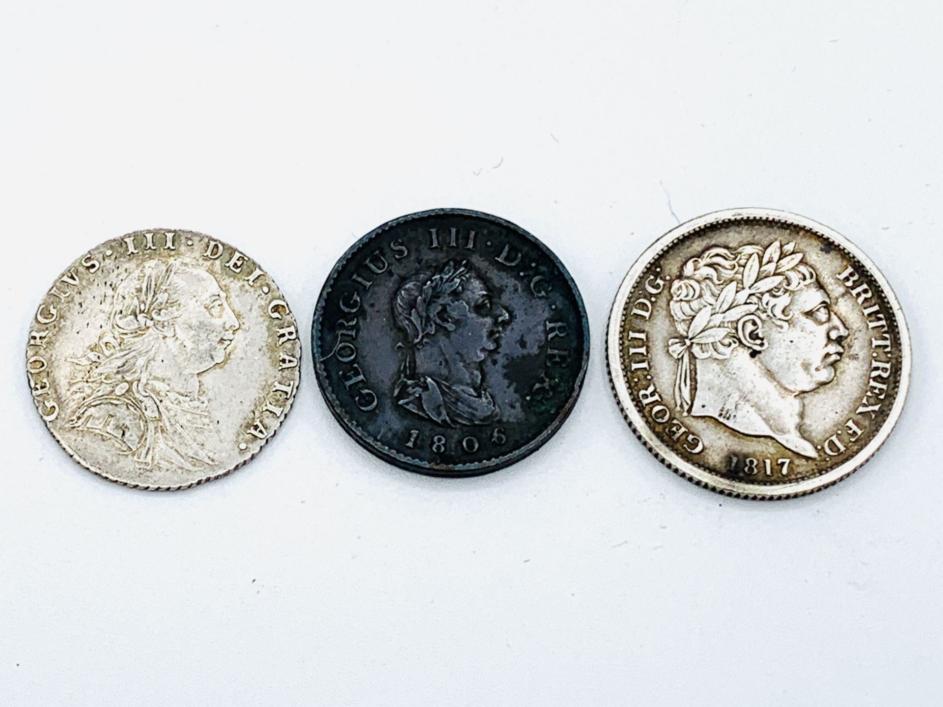 George III Silver Shilling 1787, a George III Silver Shilling 1817, and a George III penny 1806 - Image 2 of 6