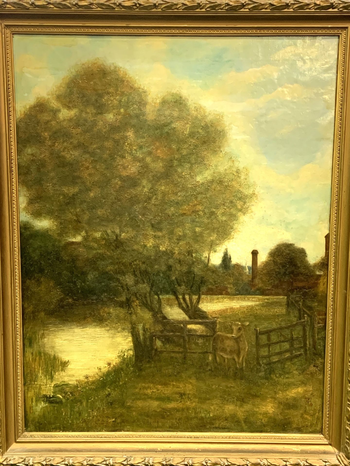 Heavy gilt framed oil on canvas of a cow in a meadow by a river - Image 2 of 2