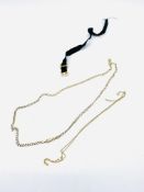 9ct gold flat chain necklace, 9ct gold very fine chain, a black fabric strap with 9ct gold clasp