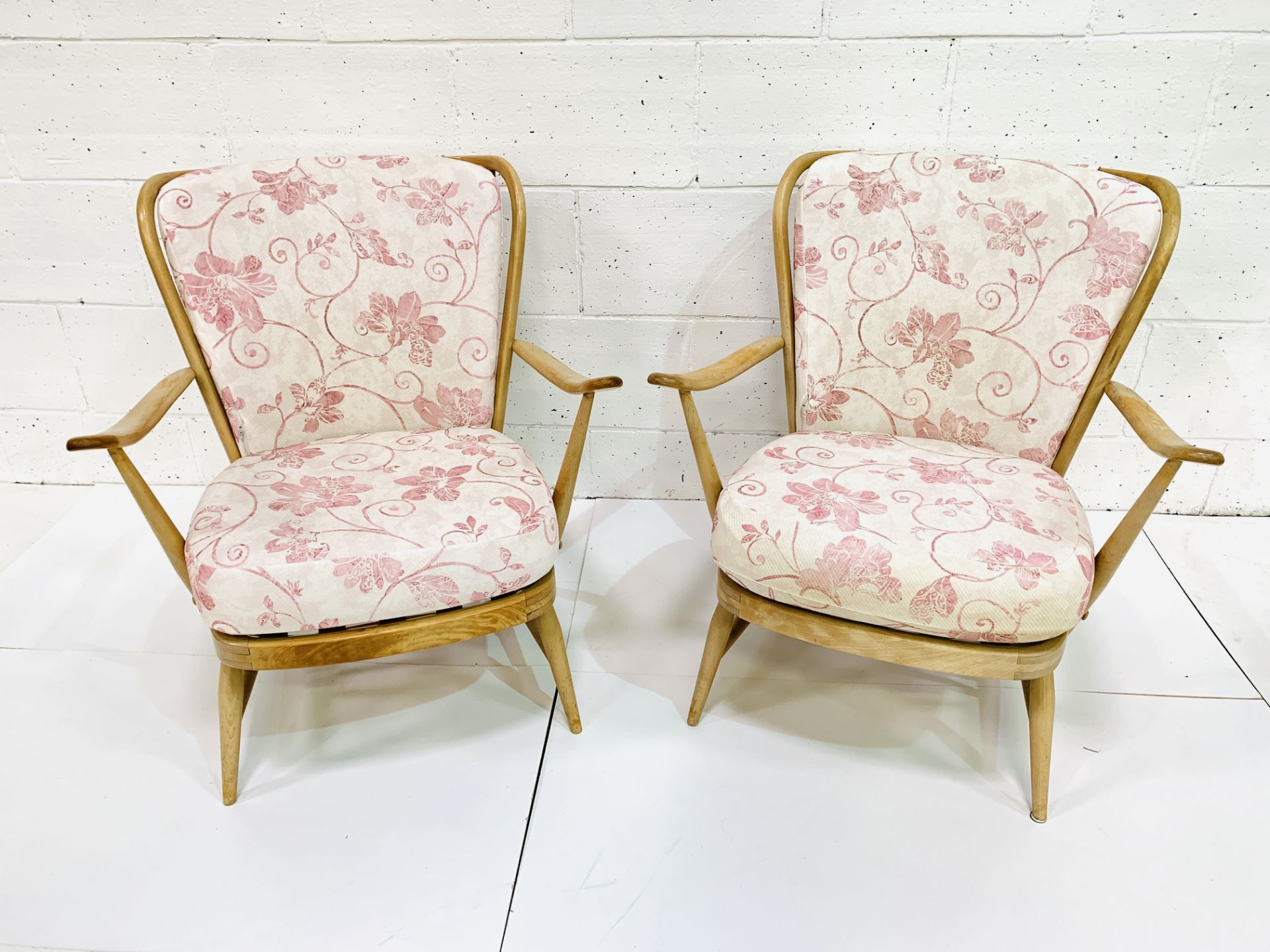 Pair of Ercol rail back armchairs