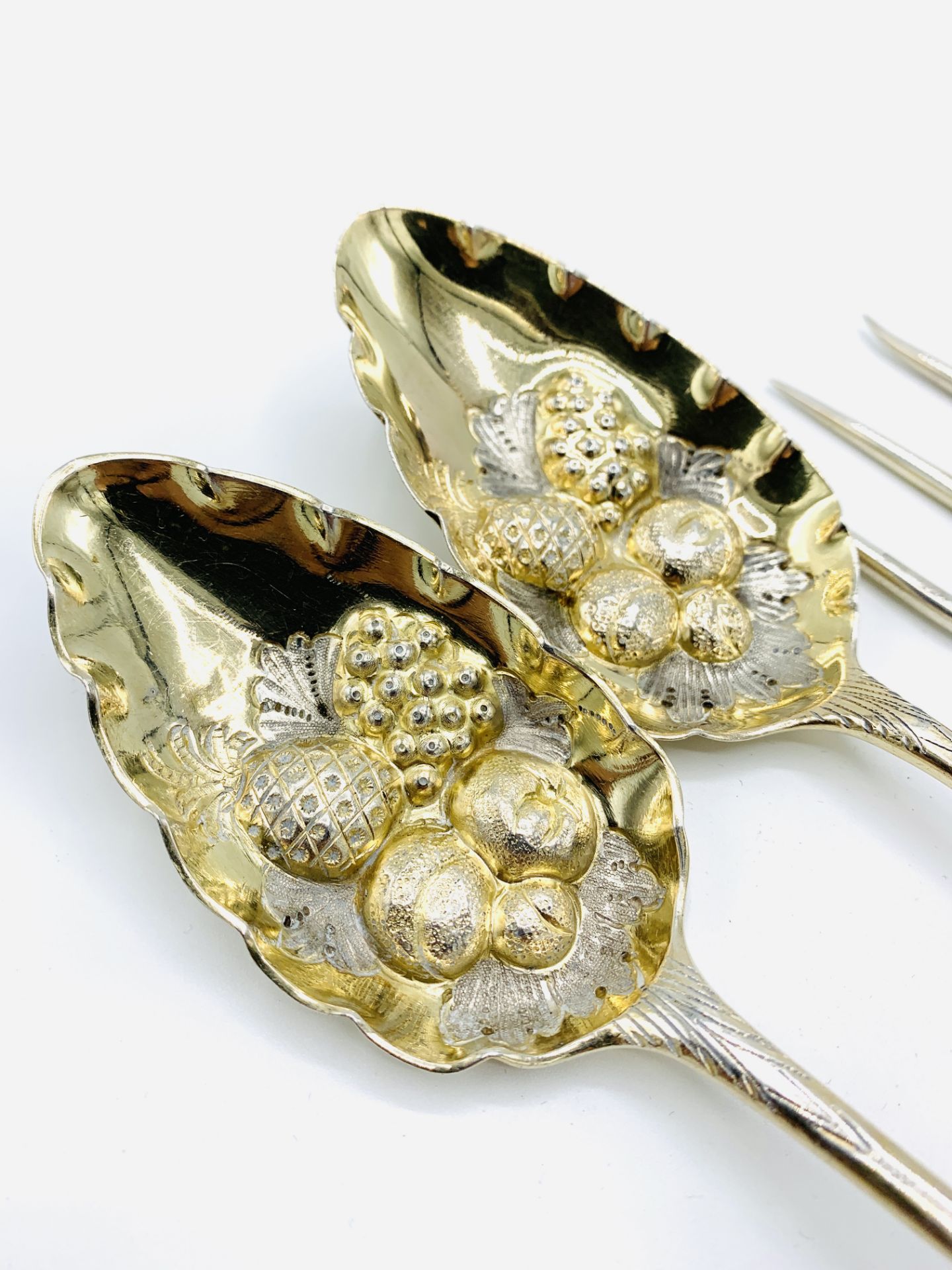 Two George III silver and gilt berry spoons and a silver 3 prong fork - Image 2 of 4