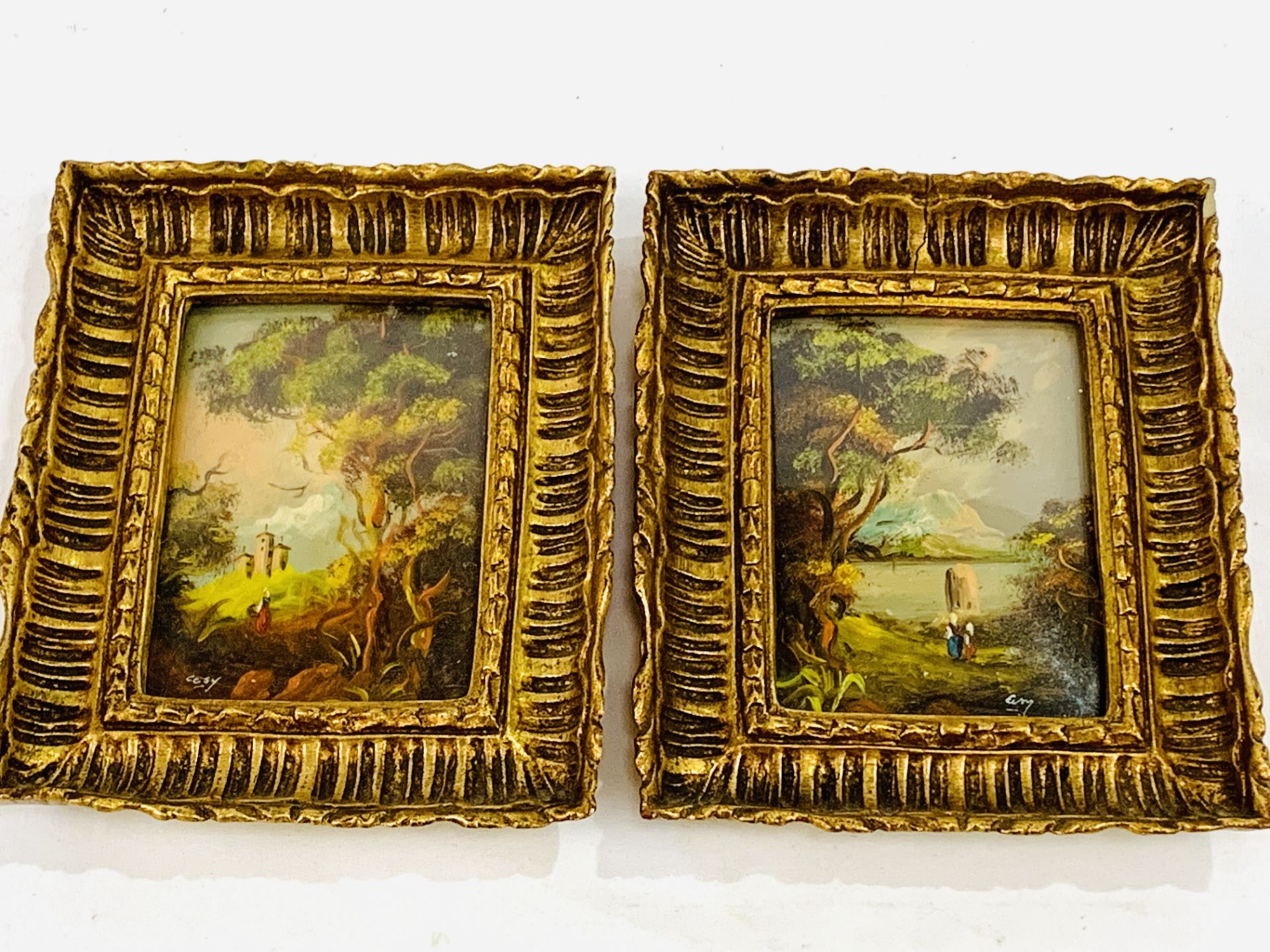 Two framed and glazed gilt oil on copper miniatures of figures in a woodland scene