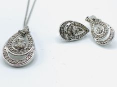 9ct white gold set of earrings, pendant and chain.