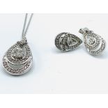 9ct white gold set of earrings, pendant and chain.