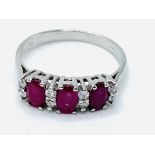 18ct white gold three stone ruby and diamond ring