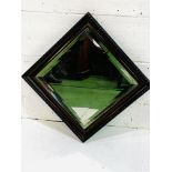 Carved decorative wood framed mirror with double bevelled edge glass.