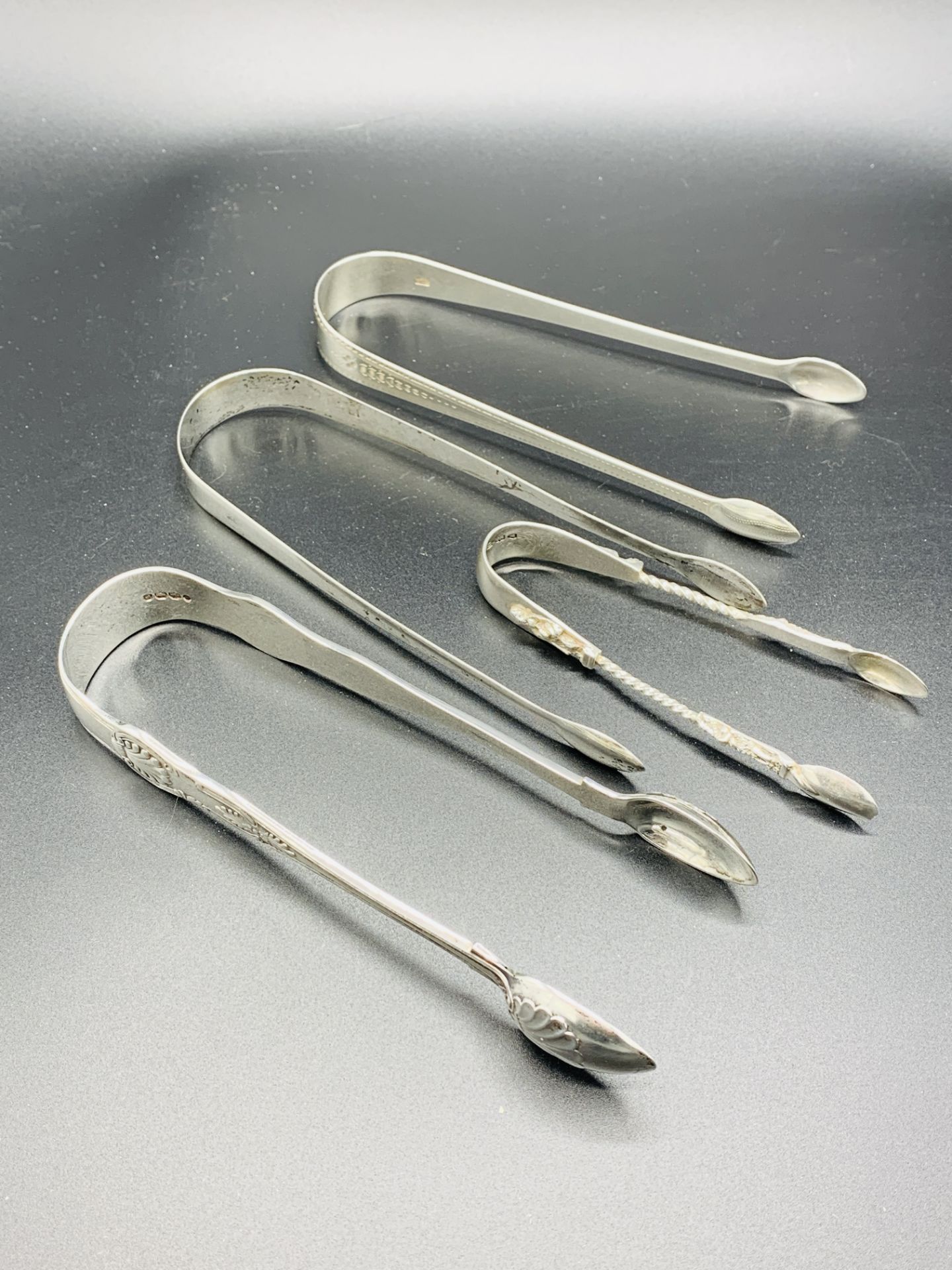 Four silver sugar tongs - Image 3 of 3