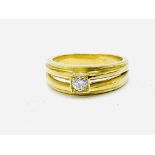 Gold split shank bezel set diamond solitaire ring