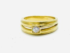 Gold split shank bezel set diamond solitaire ring