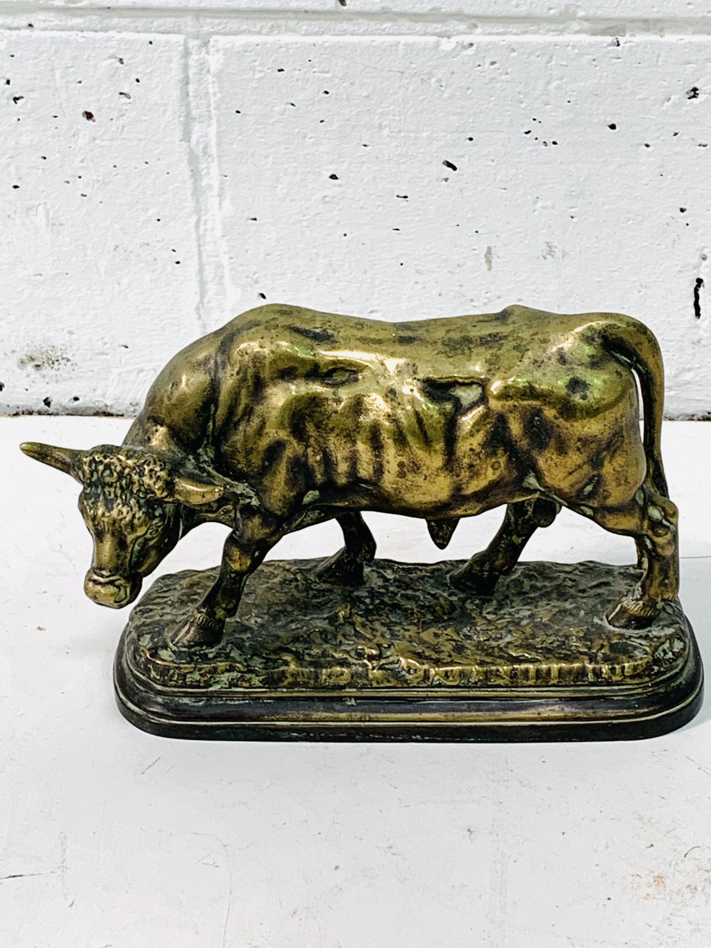 Brass figure of a bull on stand