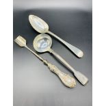 Victorian silver table spoon, a Victorian silver ladle, and a silver handled stilton cheese scoop.