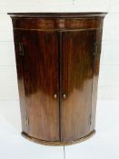 Georgian mahogany bow fronted wall mounted cabinet