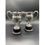 Two silver two-handled trophies