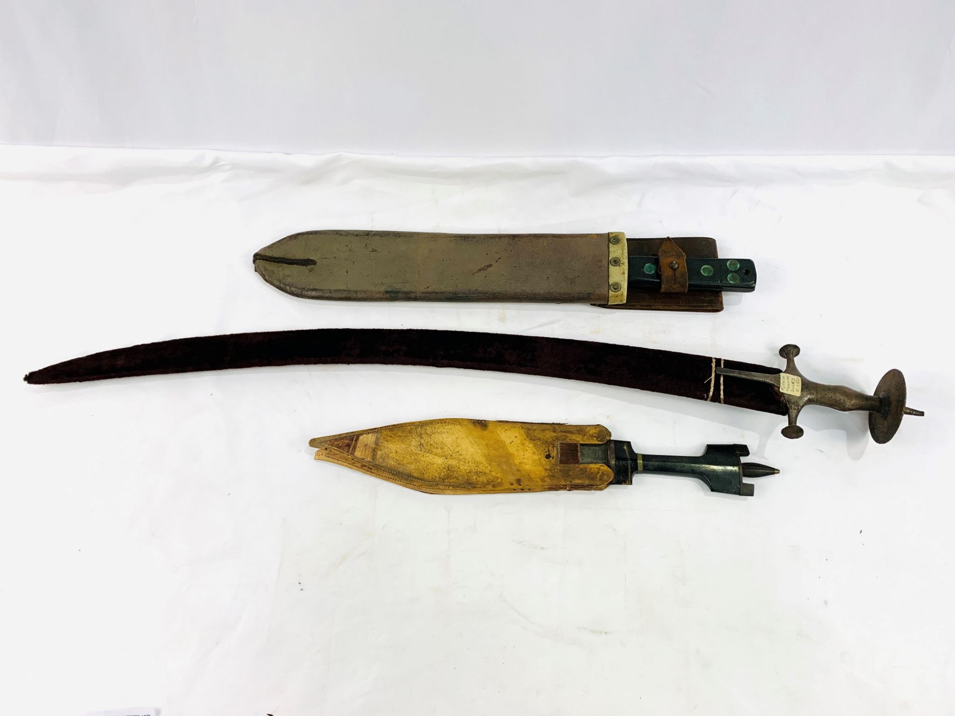 19th century Tulwar or Talwar, a Martindale WW2 machete, and a short sword