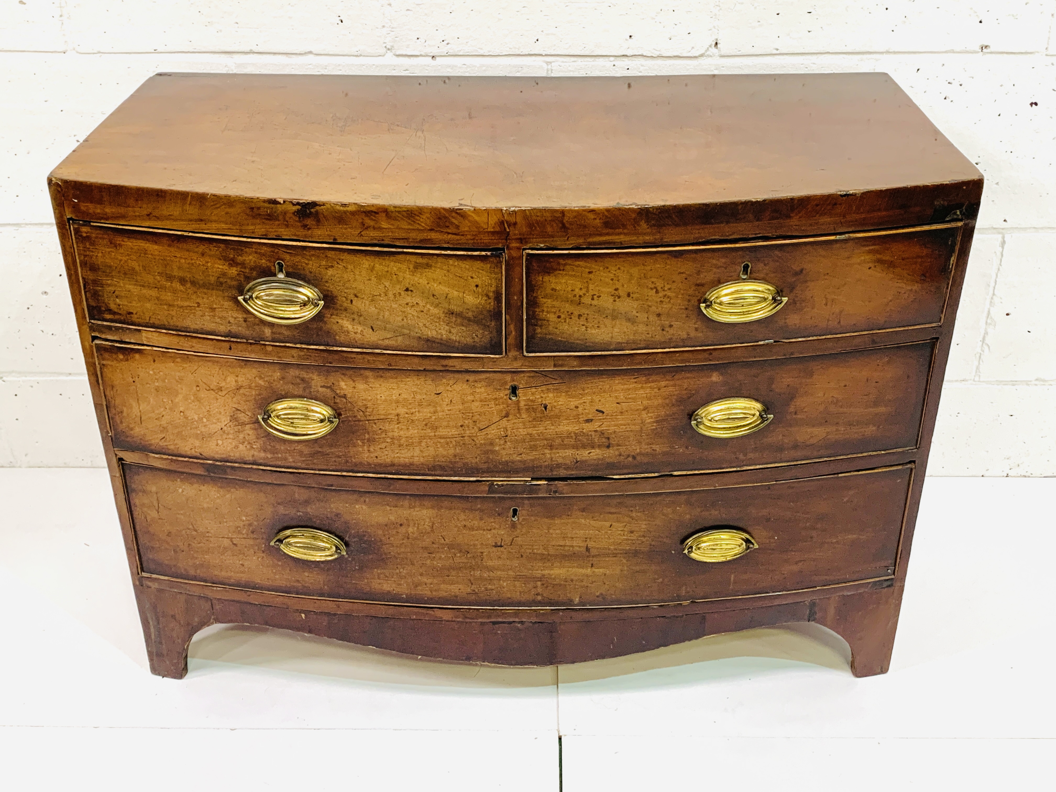 Early 19th Century bow fronted mahogany veneer chest of drawers