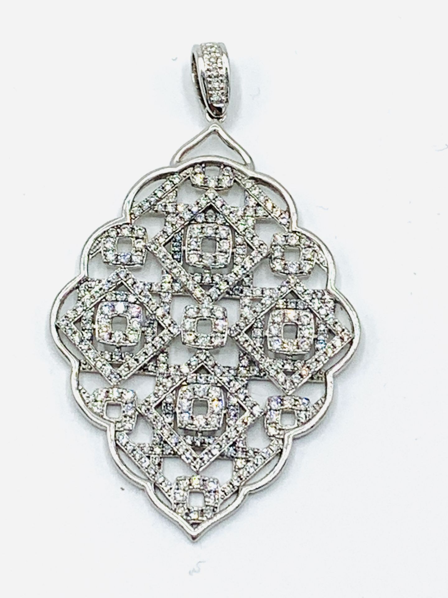 18ct white gold and diamond filigree leaf shaped pendant