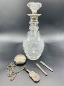 Cut glass decanter with hallmarked silver rim, and various silver items
