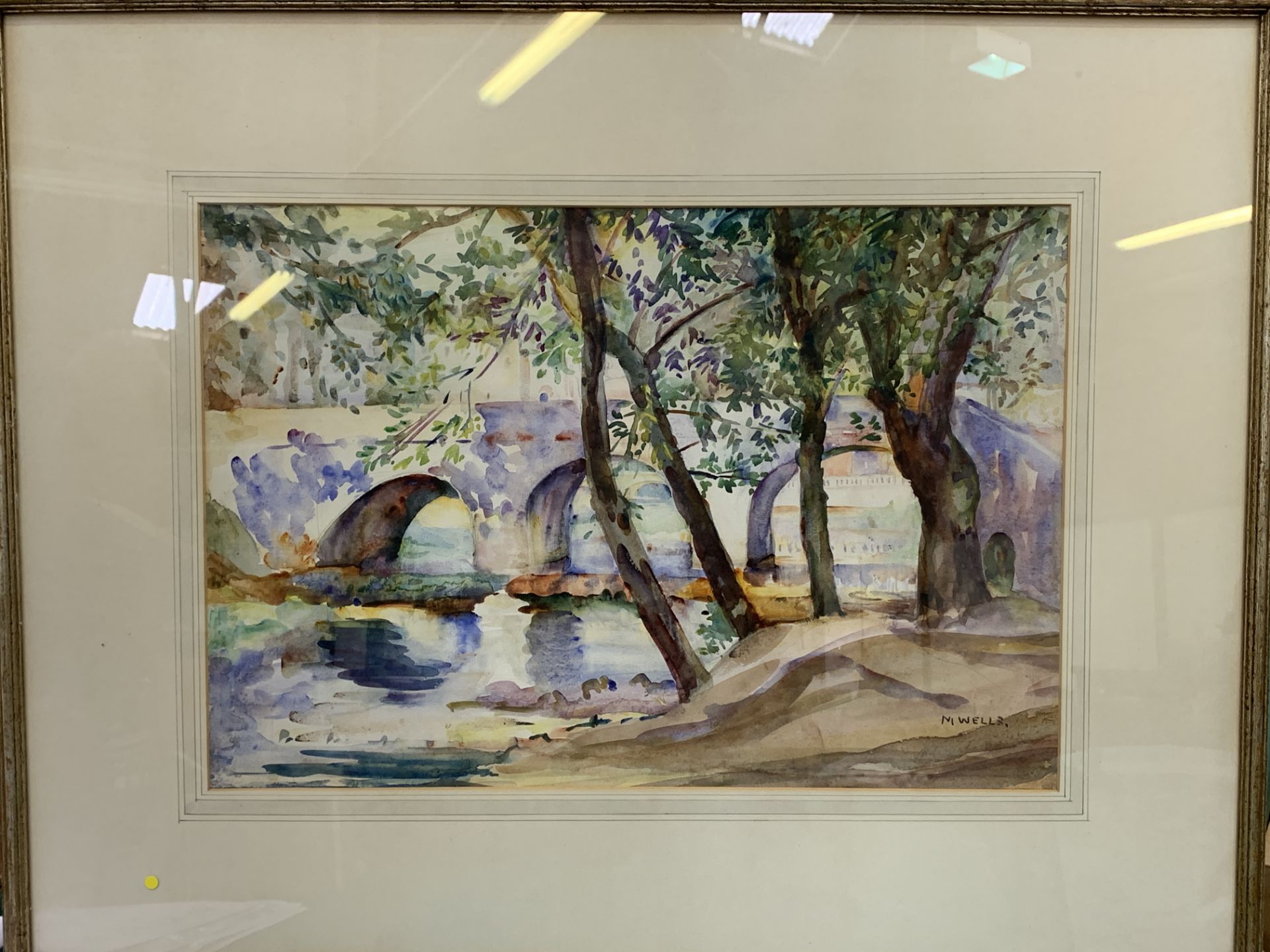 Framed and glazed watercolour of trees by a river and a bridge, signed M Wells - Image 3 of 3