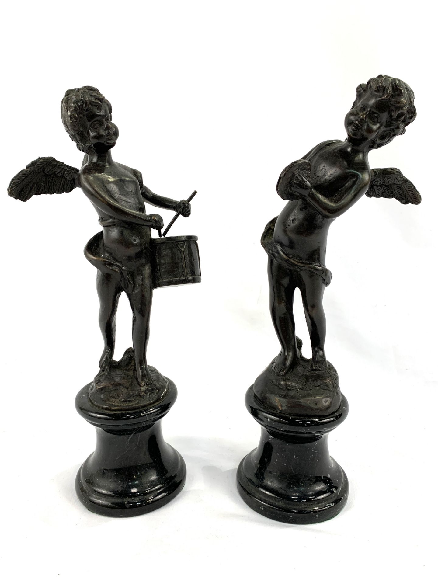 Pair of signed bronze figurines of putti on speckled marble bases, signed Auguste Moreau.