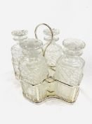 Silver plate tantalus with four cut glass decanters