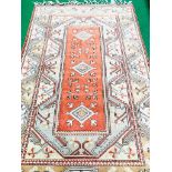 Salmon pink geometric pattern rug