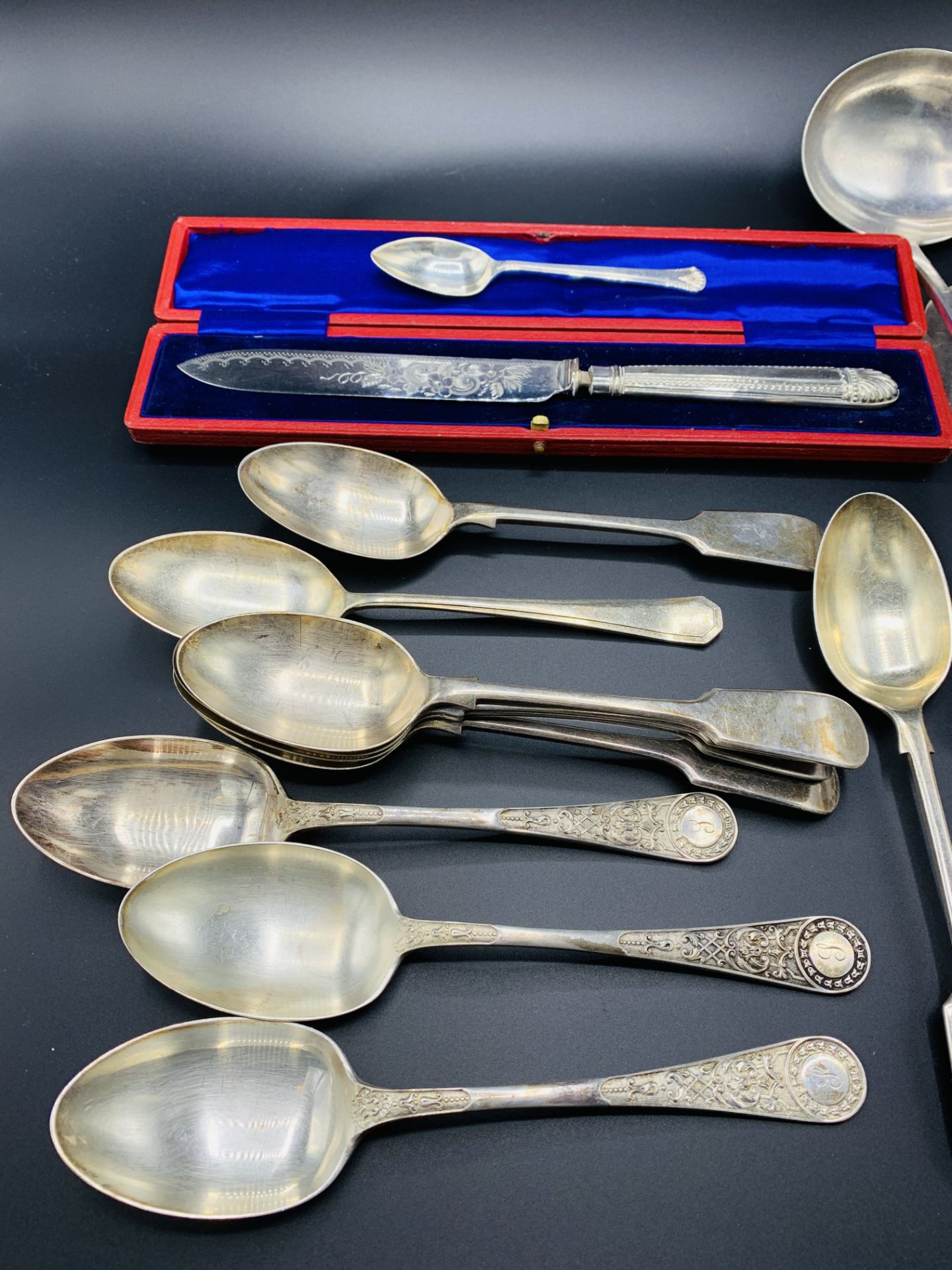 A collection of silver plate cutlery and a bronzed metal candle snuffer. - Image 2 of 5