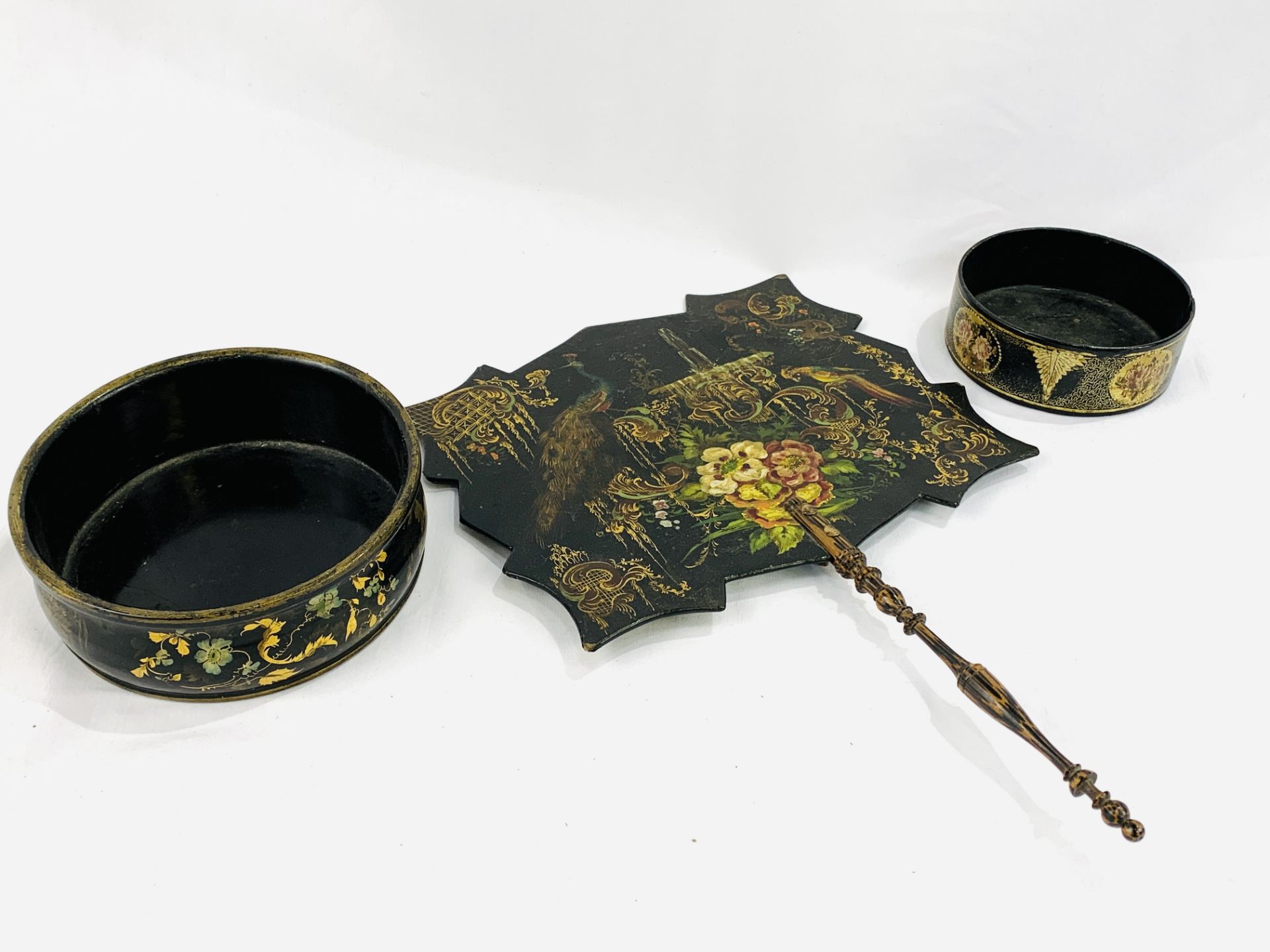 Black shaped wooden fan together with two papier mache bowls
