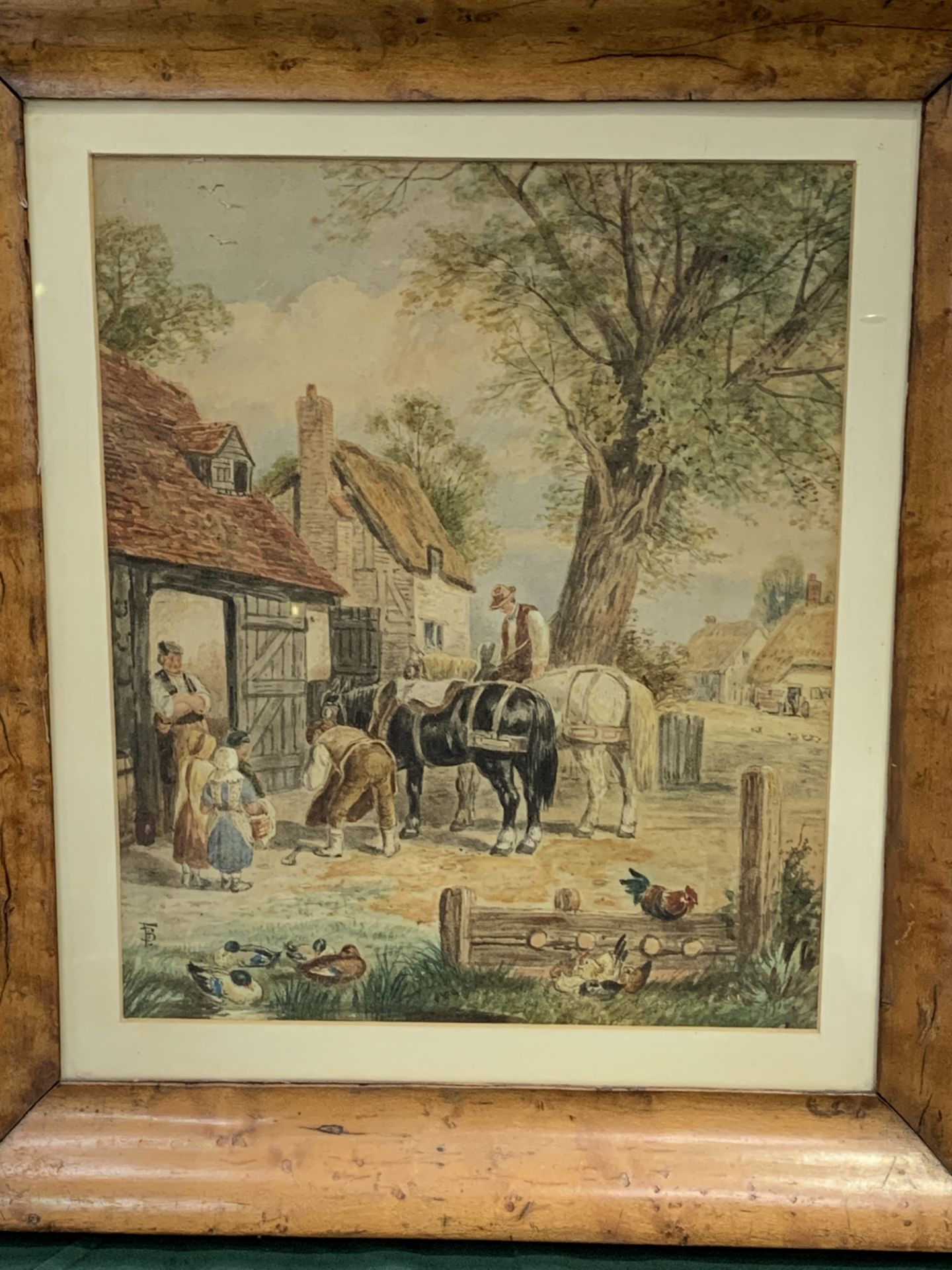 Walnut framed and glazed watercolour of cart horses at a village forge, monogram F.B